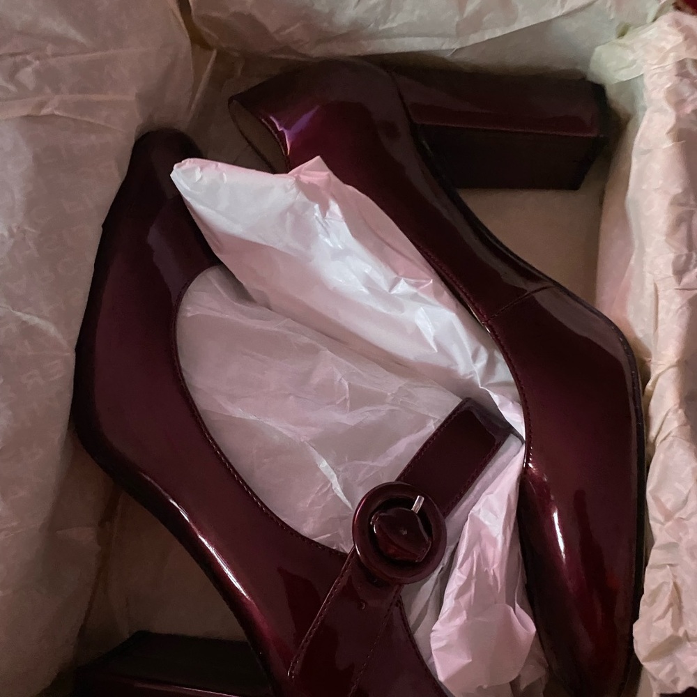 Patten leather red shoes in size 10 in great condition.